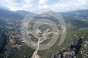 Top view to the forested valley on a cloudy day.