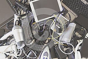 Top view to old computers, digital tablets, mobile phones, many used electronic gadgets devices, broken household and