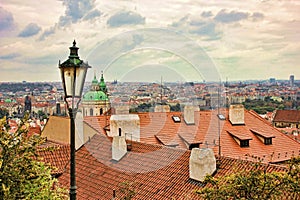 Top view to red tile roofs of Prague city Czech republic. Typical Prague houses