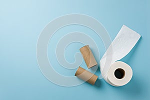 Top view of toilet paper roll on blue background