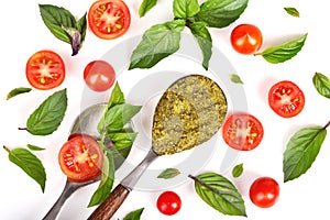 Top view of tomatoes, basil anf pesto