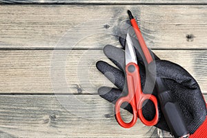 Top view of tools and safety equipment for electrical system on wooden background