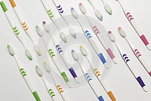 Top view of toothbrushes in colorful on pastel color background