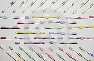 Top view of toothbrushes in colorful on pastel color background