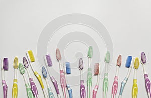 Top view of toothbrushes in colorful on pastel color background