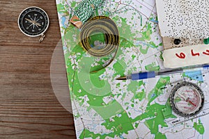 Top view of topographic map and compass