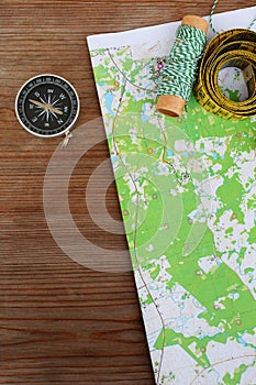 Top view of topographic map and compass