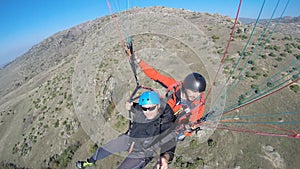 Top view of tourist paragliding