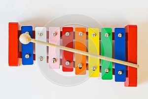 Top view, toy colorful xylophone, on the white table.