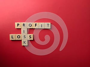 Top view toys letters with the word PROFIT RISK LOSS