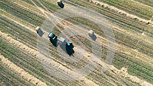 Top view of a tractor in the process of haymaking