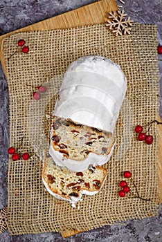 Top view of traditional German christmas season sweet food called `Stollen` or `Christstollen`, a fruit bread of nuts, spices