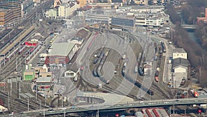 Top view of trains moving on railroad at busy railway station