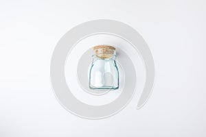 Top view of transparent glass bottle with bung