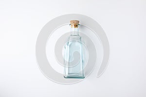 Top view of transparent glass bottle with cork