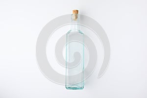 Top view of transparent glass bottle with plug