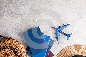 Top view of traveler accessories with a hat, Passport , plane. Preparation for travel. Traveling Journey Vacation Holiday concept