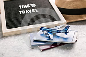 Top view of traveler accessories with a hat, Passport , plane. Preparation for travel. Traveling Journey Vacation Holiday concept