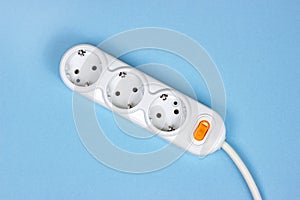 Top view of triple socket European power adapter with different wires at home. Standard electrical plug power outlet