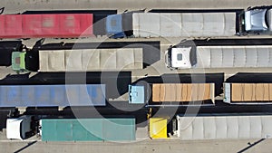 Top view of trucks with loaded grain in containers.