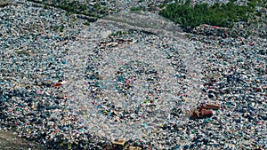 Top view of trucks unload garbage to landfill among nature