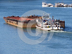 Top view of Tugboat pushing a empty barge on the river