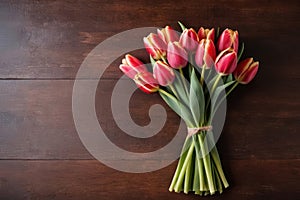 top view of tulips on wooden table