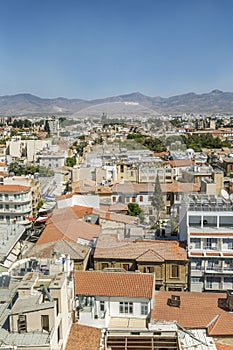 Top view of the Turkish part of Nicosia. Traditional architecture and mosques with minarets against the backdrop of mountains with