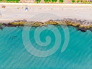 Top view of turquoise sea and sandy