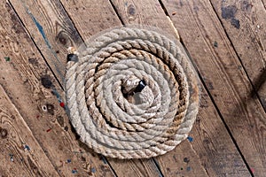 Top view of a twisted spiral rope on a wooden surface
