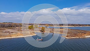 Top view two anglers fishing from motor boat at Murrell Park, Lake Grapevine, Texas, USA