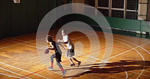 Top view of two basketball players curly dribbling night game confrontation attack defence confrontation sports
