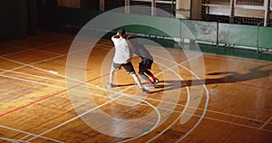 Top view of two basketball players curly dribbling night game standoff attack defense standoff sport endurance