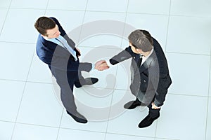 Top view of a two businessman shaking hands