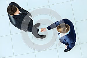 Top view of a two businessman shaking hands