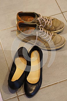 Top view of Two pairs of shoes in the hall in Poznan, Poland