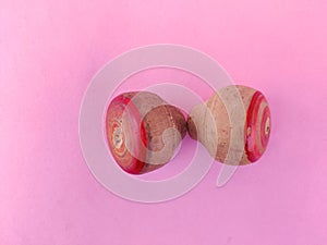 Top view of two small wooden spinning top toys