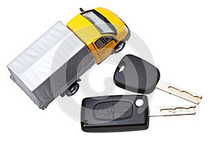 Top view of two vehicle keys and truck model