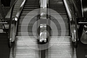 Top view of two way escalator in black and white