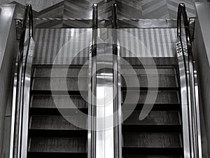 Top view of two way escalator in black and white