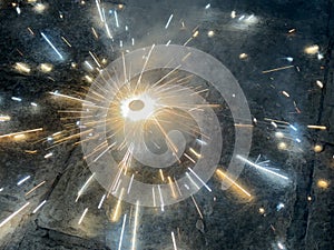 A top view of a type of firework cracker known as Chakra or Chakri rotating on the ground, during the Diwali festival celebrations