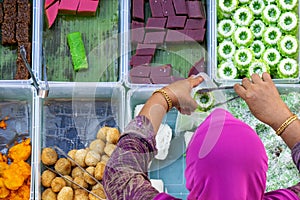 Top view of unidentified vendor at the food stall in Kota Kinabalu city food market