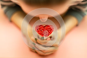 top view using blur on a girl holding a lollipop