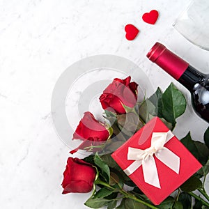 Top view of Valentine day gift with rose and wine, festive meal design concept