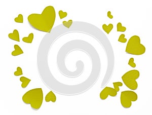 Top view valentines day decorations flat lay. Green yellow hearts on white background. Happy St. Valentine`s Day banner