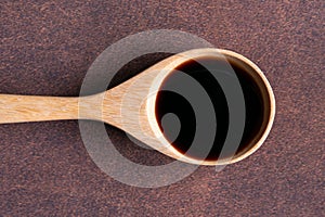 Vanilla Extract on a Wood Spoon photo