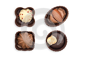 Top view of various chocolate candies isolated on white background