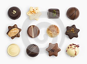 Top view of various chocolate pralines isolated on white background