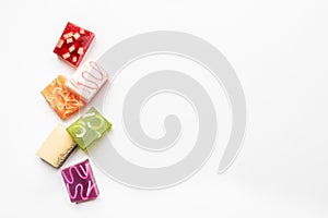 Top view of various colorful handmade soaps. Organic health care and protection. Copy space, white background