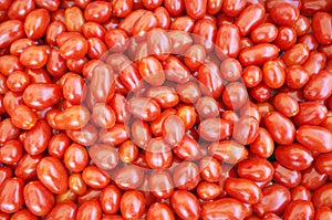 Top view vibrant red cherry tomatoes close up.
